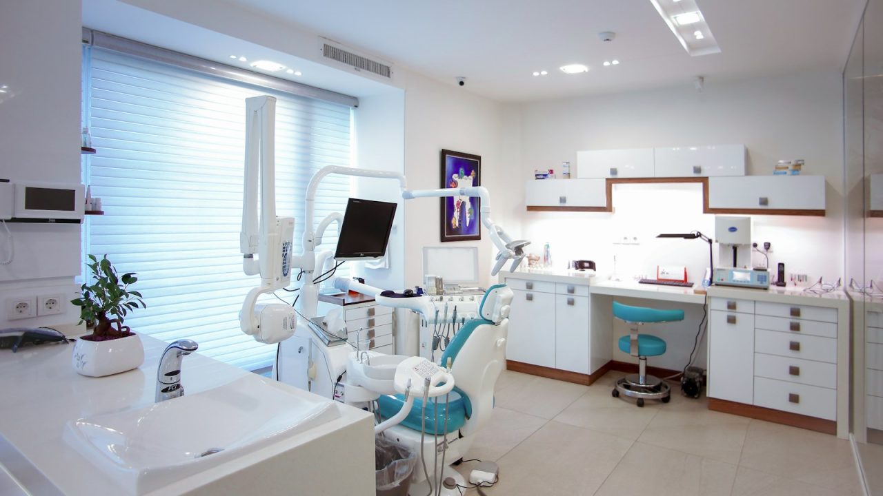 Modern dental treatment room with a patient chair and equipment, ready for the next booked appointment